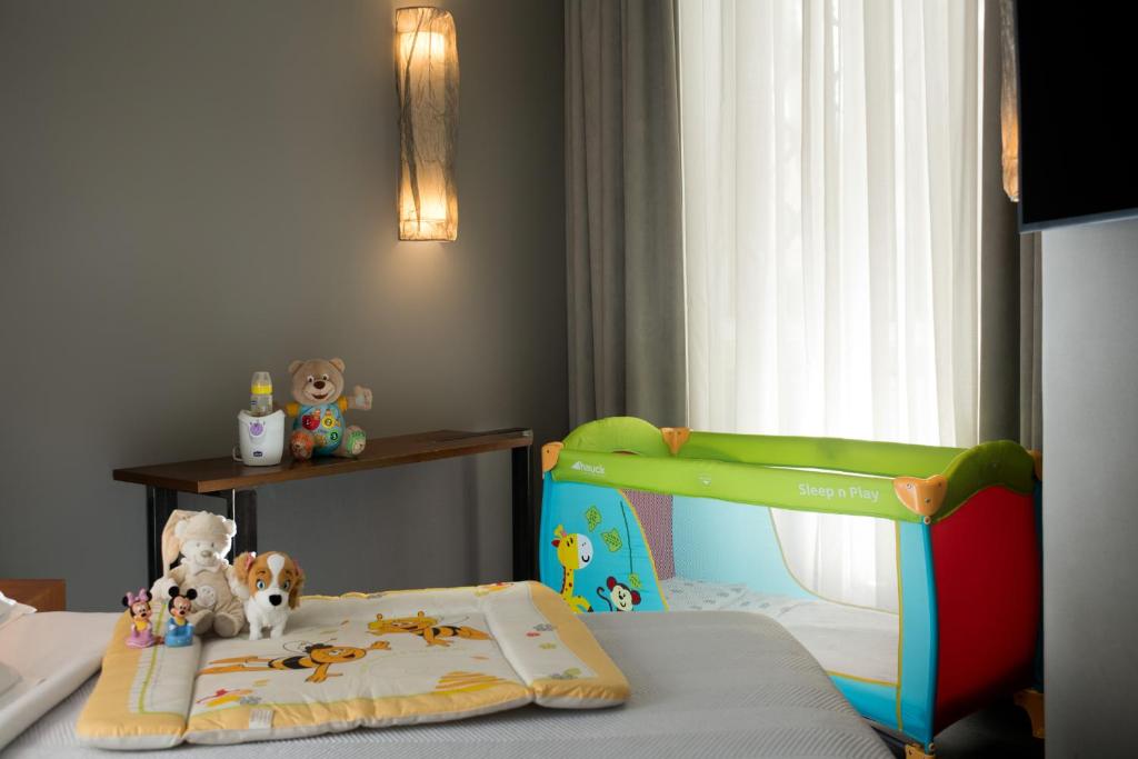 Postel nebo postele na pokoji v ubytování Metropolis - Hotel di Charme