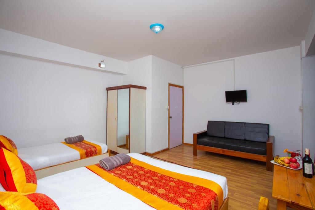 Postel nebo postele na pokoji v ubytování The Boudha Inn