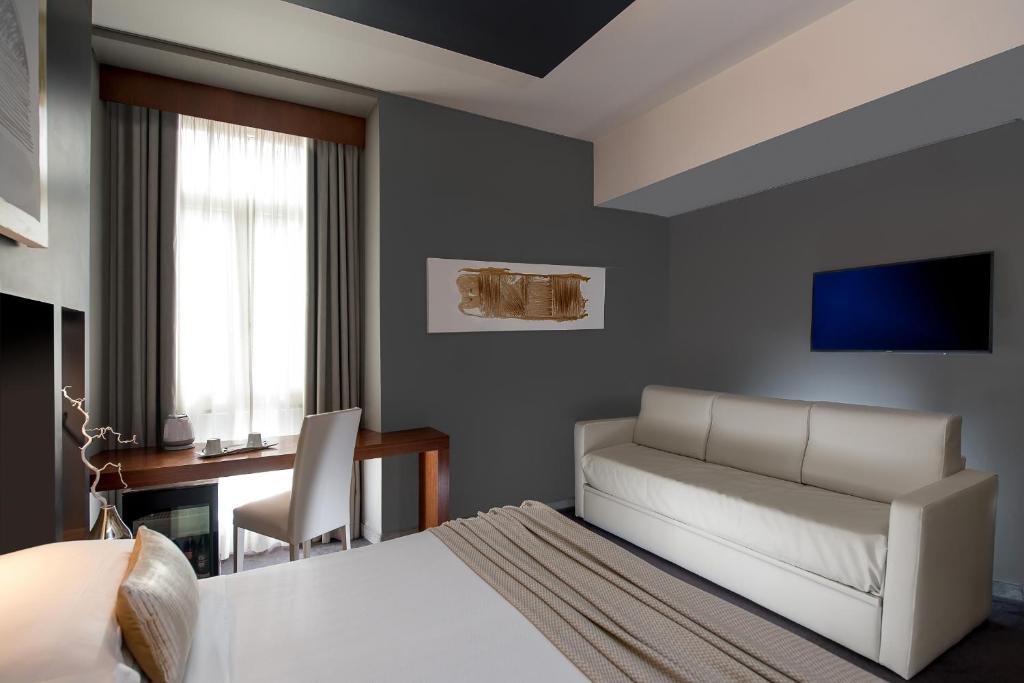 TV a/nebo společenská místnost v ubytování Metropolis - Hotel di Charme