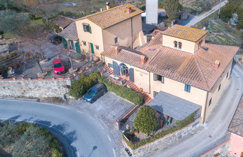 an aerial view of a large house with a road at Montechiari In Chianti in Greve in Chianti