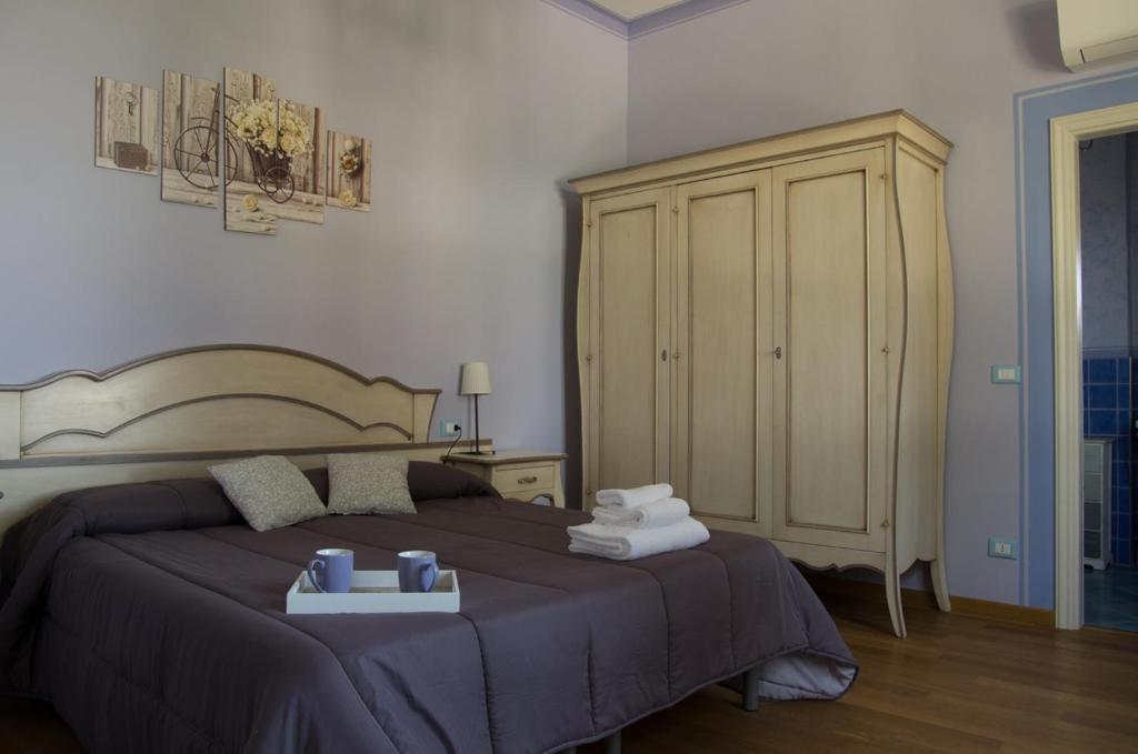 A bed or beds in a room at Locanda Corte Roveri
