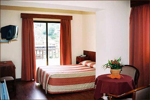 Postel nebo postele na pokoji v ubytování Ekali Hotel