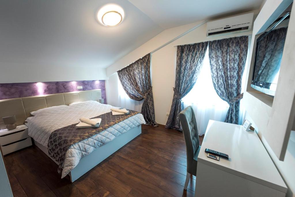 Postel nebo postele na pokoji v ubytování Hotel Oasis