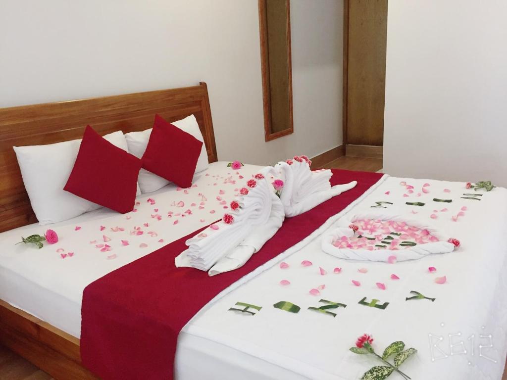 Postel nebo postele na pokoji v ubytování Ngoc Viet Bungalow