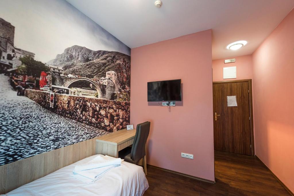 TV a/nebo společenská místnost v ubytování Hotel Oasis