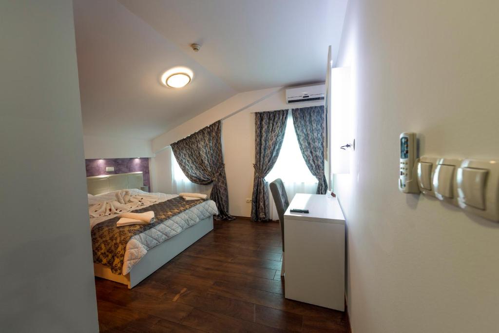 Postel nebo postele na pokoji v ubytování Hotel Oasis