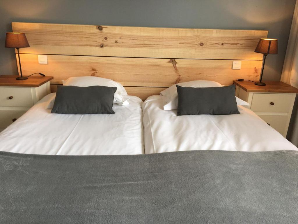 Postel nebo postele na pokoji v ubytování Le Pavillon Bleu