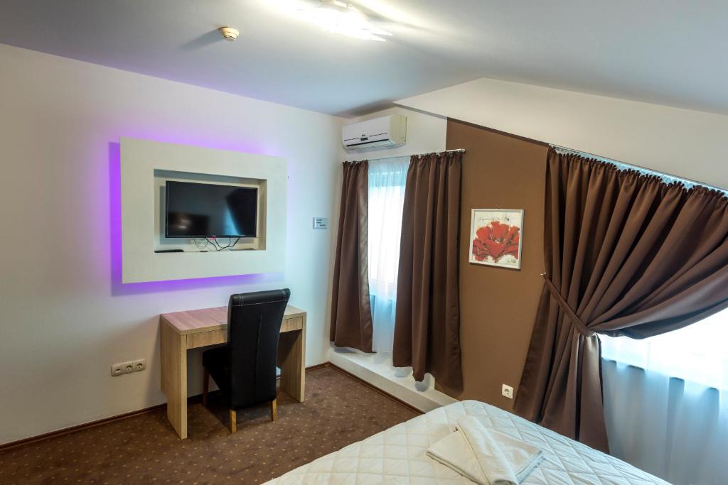 TV a/nebo společenská místnost v ubytování Hotel Oasis