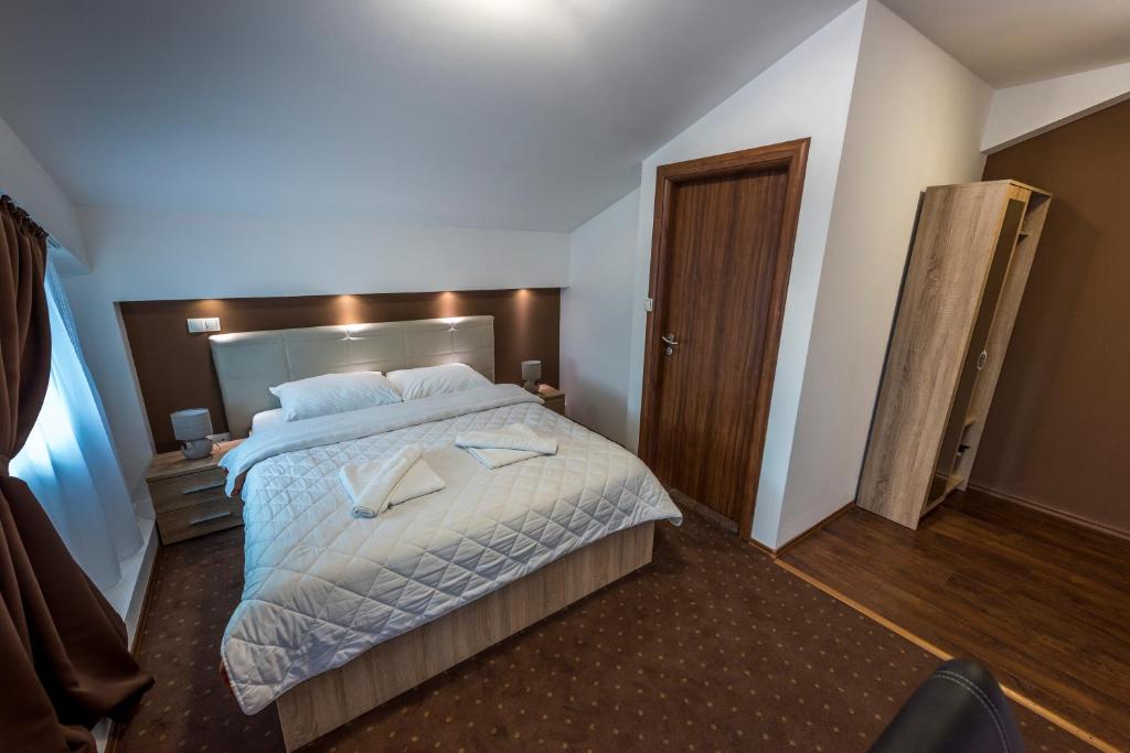 Postel nebo postele na pokoji v ubytování Hotel Oasis