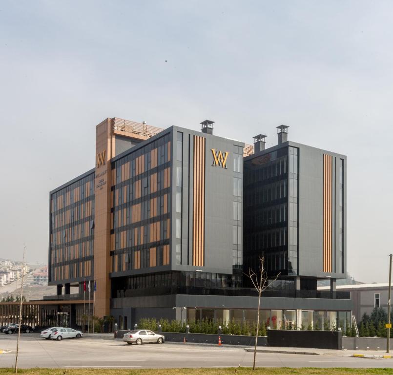 a large building with a vsw logo on it at Willmont Hotel in Balıkesir