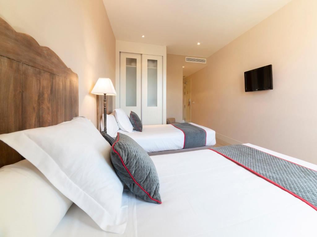 Posteľ alebo postele v izbe v ubytovaní Hotel Altora