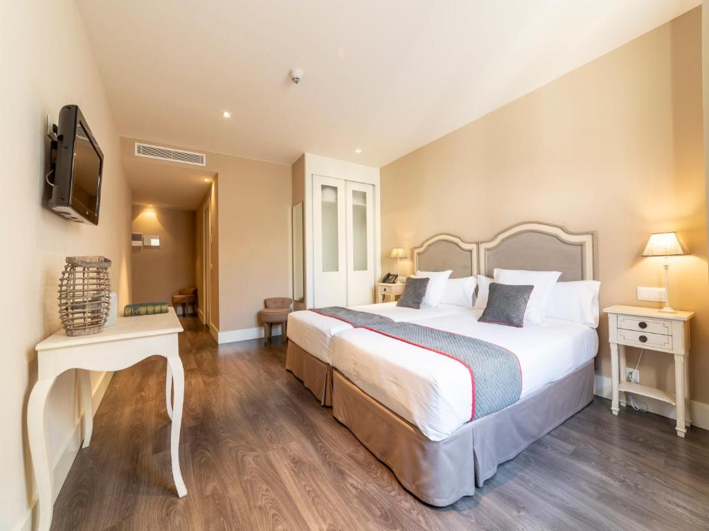 Posteľ alebo postele v izbe v ubytovaní Hotel Altora