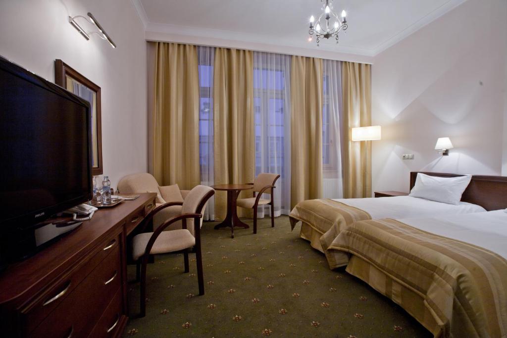 Posteľ alebo postele v izbe v ubytovaní Hotel Masovia