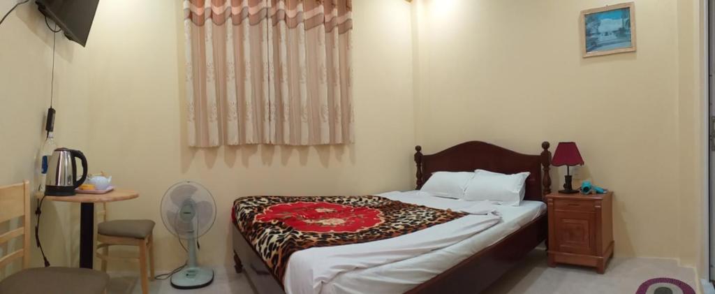 Postel nebo postele na pokoji v ubytování Nón Lá Guest House