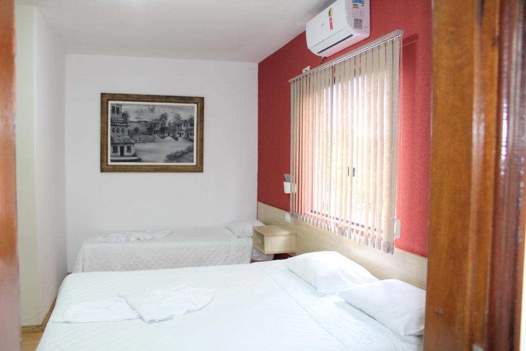 Postel nebo postele na pokoji v ubytování Hotel Dom Thomaz