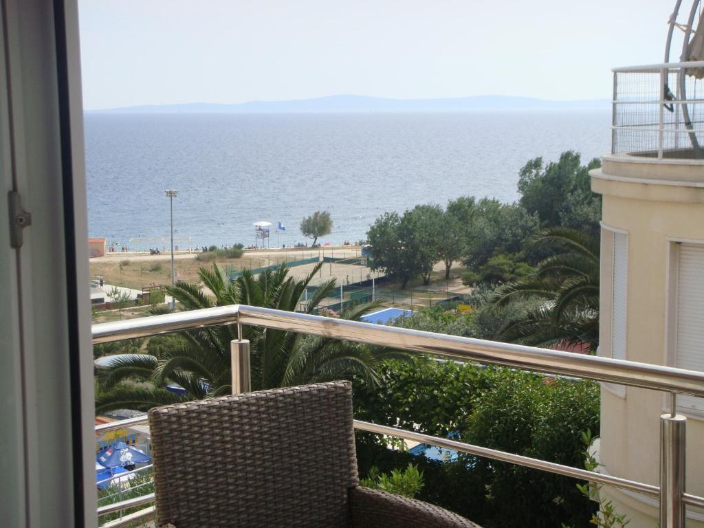 a balcony with a view of the ocean at Apartments Holiday in Split