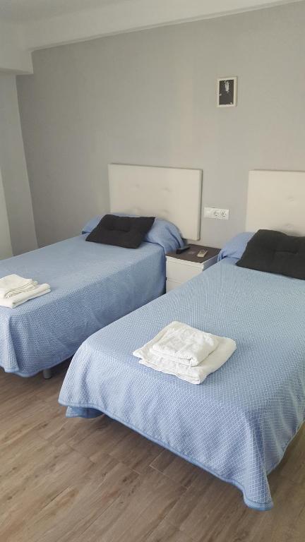 Postel nebo postele na pokoji v ubytování Guesthouse Central