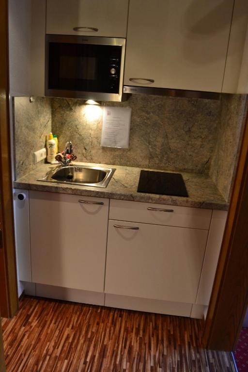 Kuchyň nebo kuchyňský kout v ubytování Haus Gfall