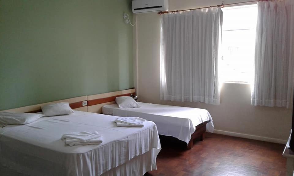 Postel nebo postele na pokoji v ubytování Hotel Premier
