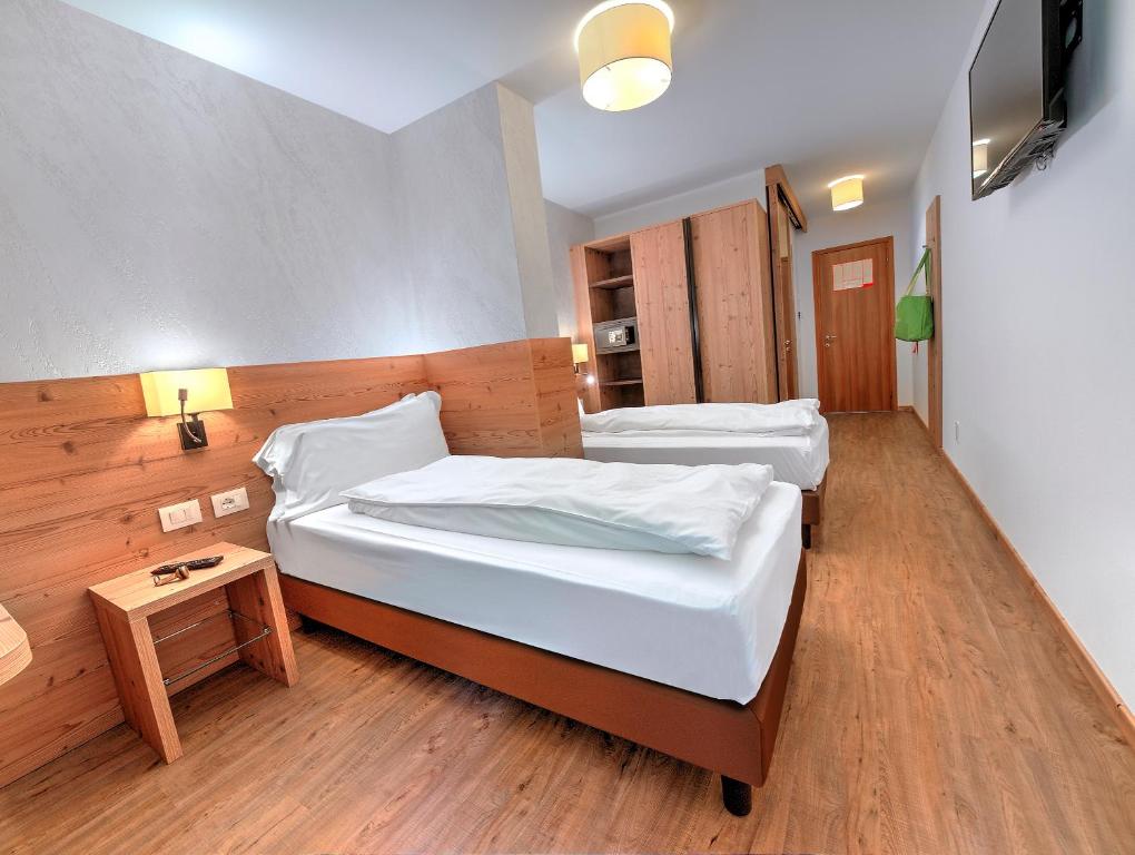 Postel nebo postele na pokoji v ubytování Luna Wellness Hotel