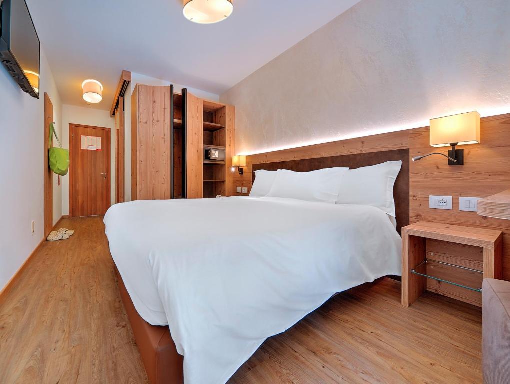 Postel nebo postele na pokoji v ubytování Luna Wellness Hotel