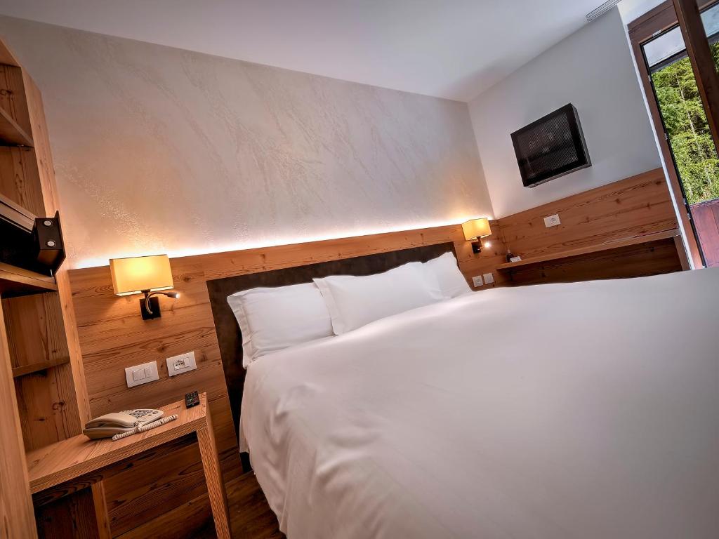 Postel nebo postele na pokoji v ubytování Luna Wellness Hotel