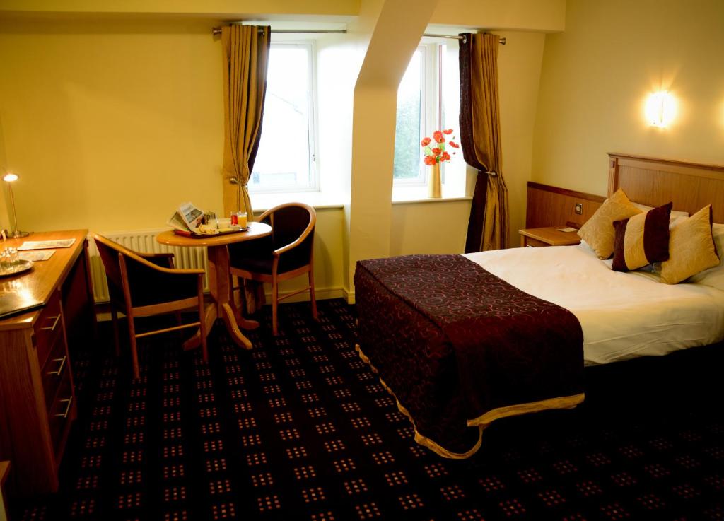 Postel nebo postele na pokoji v ubytování Bush Hotel