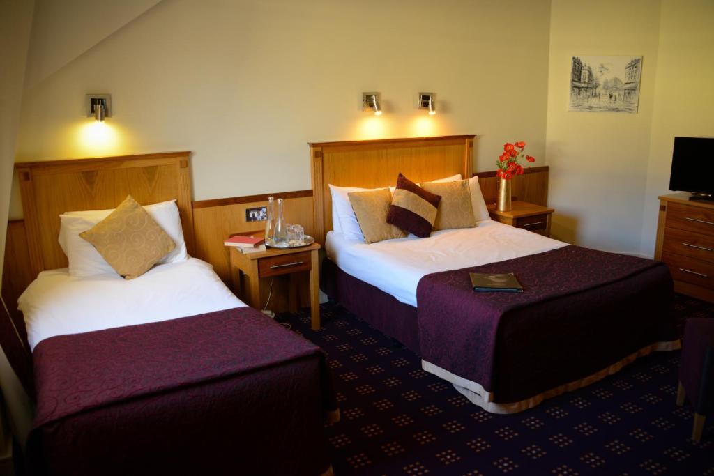 Postel nebo postele na pokoji v ubytování Bush Hotel