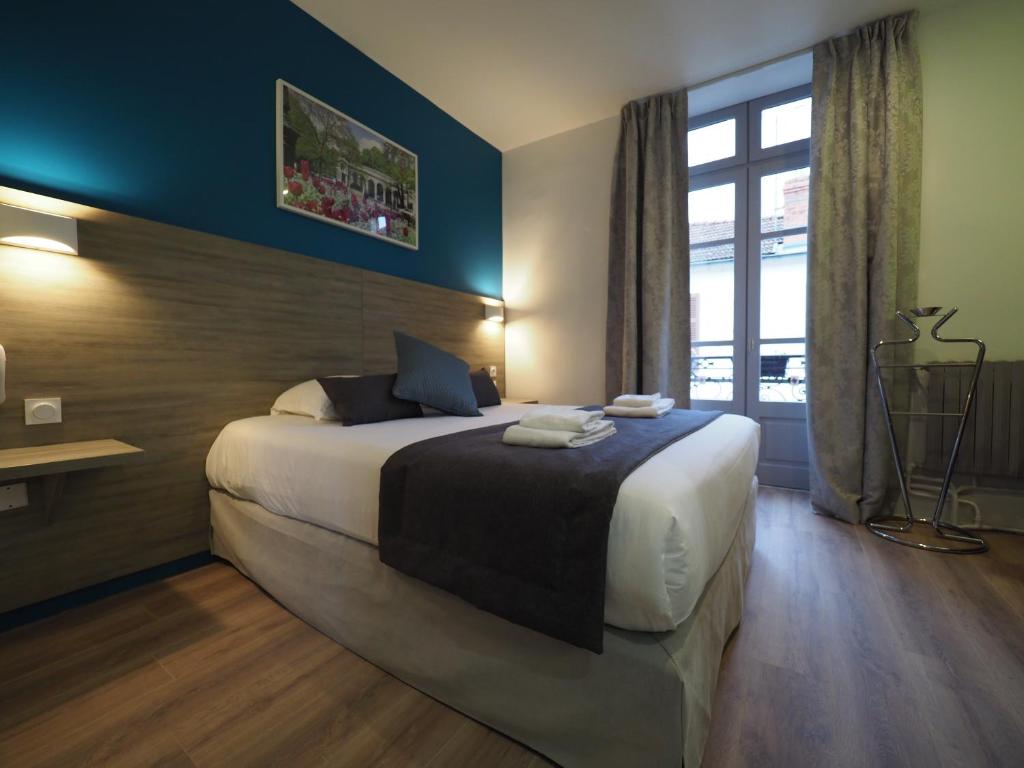 
Un ou plusieurs lits dans un hébergement de l'établissement Hôtel Le Biarritz - Vichy
