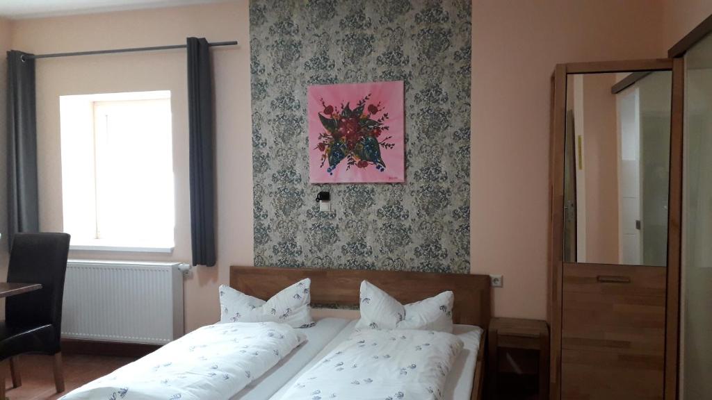 Postel nebo postele na pokoji v ubytování Hotel Wittenberg-Hotel Garni
