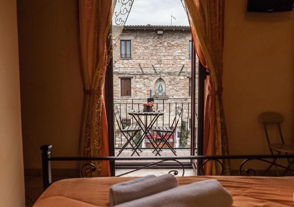 Postel nebo postele na pokoji v ubytování Camere La Basilica