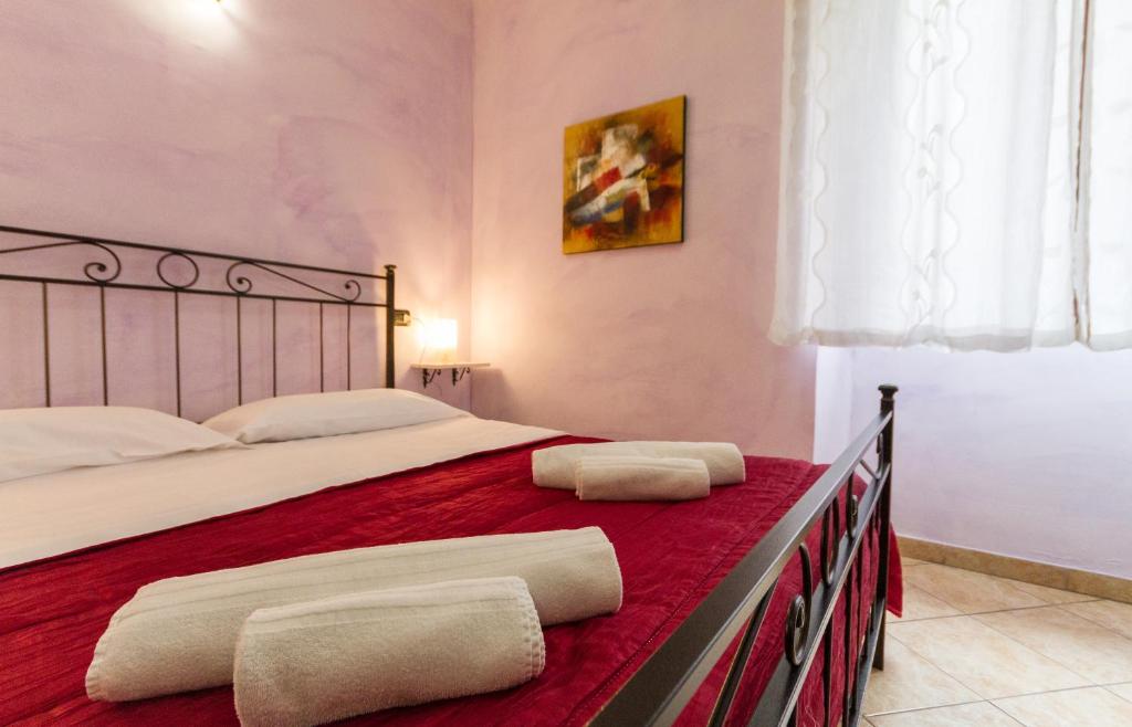 Postel nebo postele na pokoji v ubytování Camere La Basilica