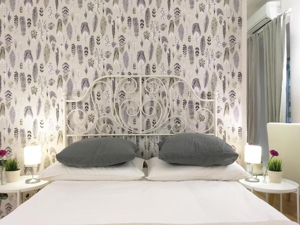 Posteľ alebo postele v izbe v ubytovaní M SuiteApartment Roma