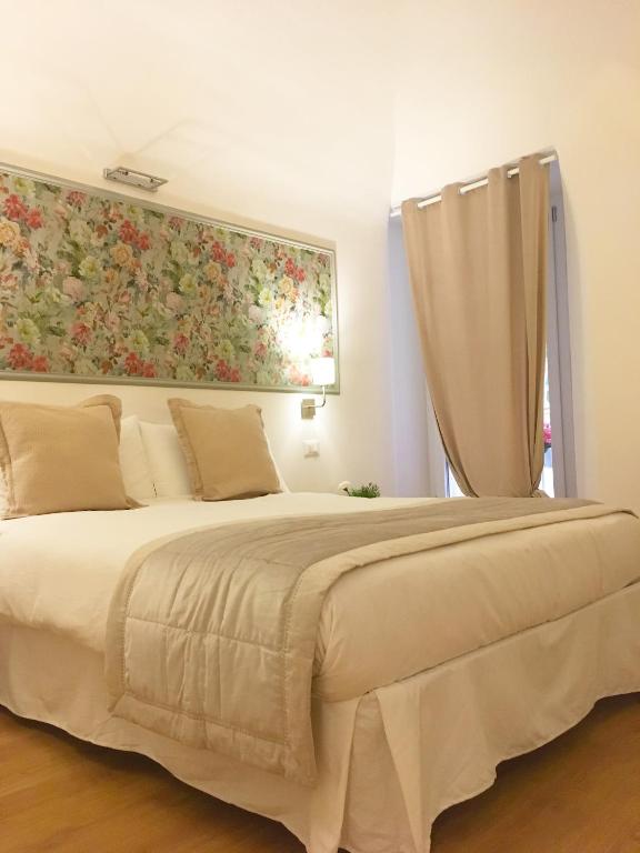 Posteľ alebo postele v izbe v ubytovaní M SuiteApartment Roma