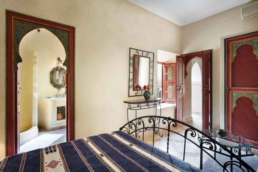 Uma cama ou camas num quarto em Riad Julia