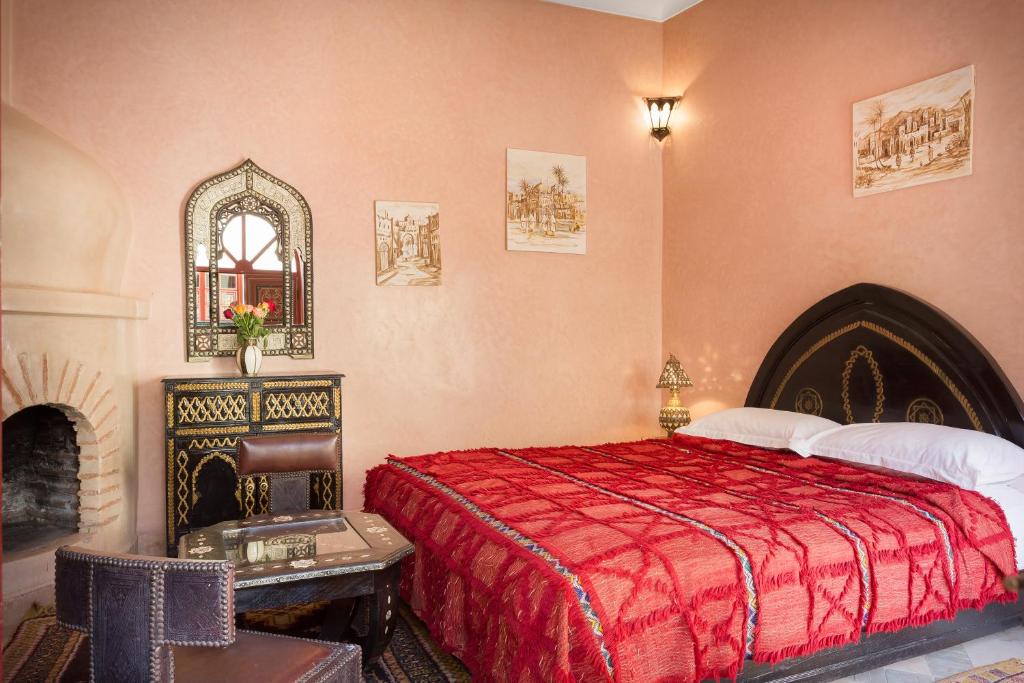 Uma cama ou camas num quarto em Riad Julia