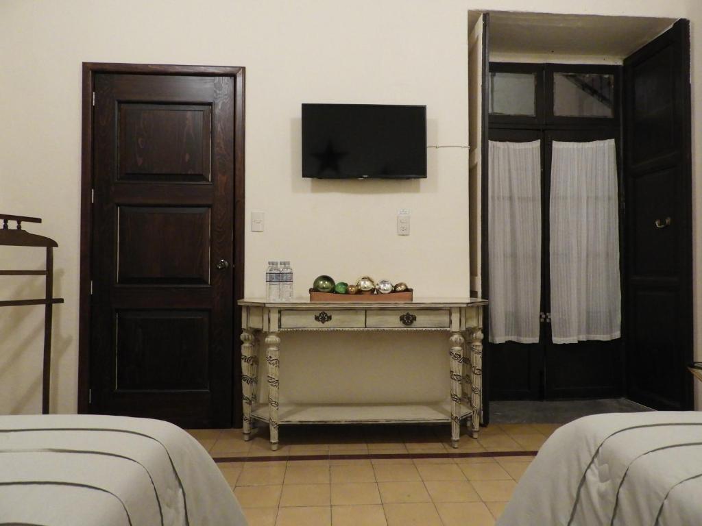 Postel nebo postele na pokoji v ubytování El Viejo Zaguan by Lunian