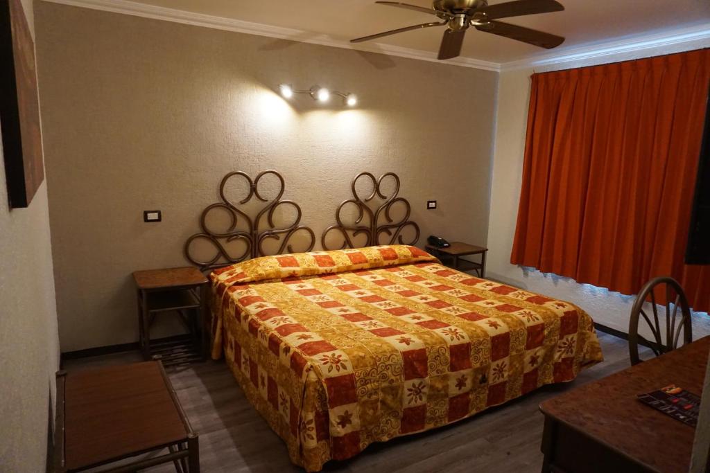 Postel nebo postele na pokoji v ubytování Hotel Plaza Crystal