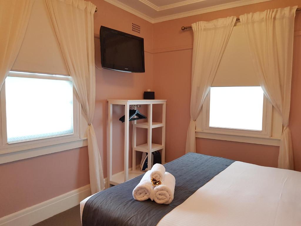 Postel nebo postele na pokoji v ubytování The Hughenden Boutique Hotel