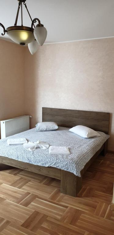 Postel nebo postele na pokoji v ubytování BigCitty Rooms