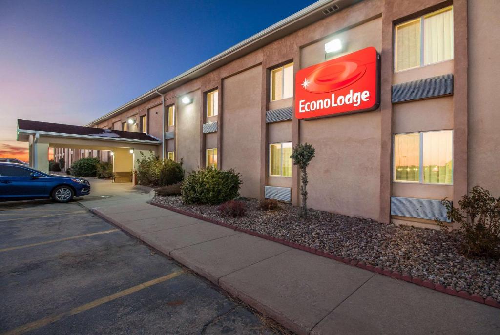 a building with a sign on the side of it at Econo Lodge in Lexington