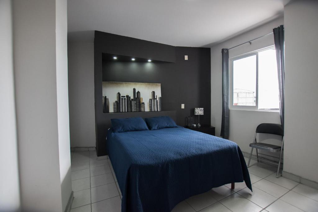 Postel nebo postele na pokoji v ubytování Hotel San Luis