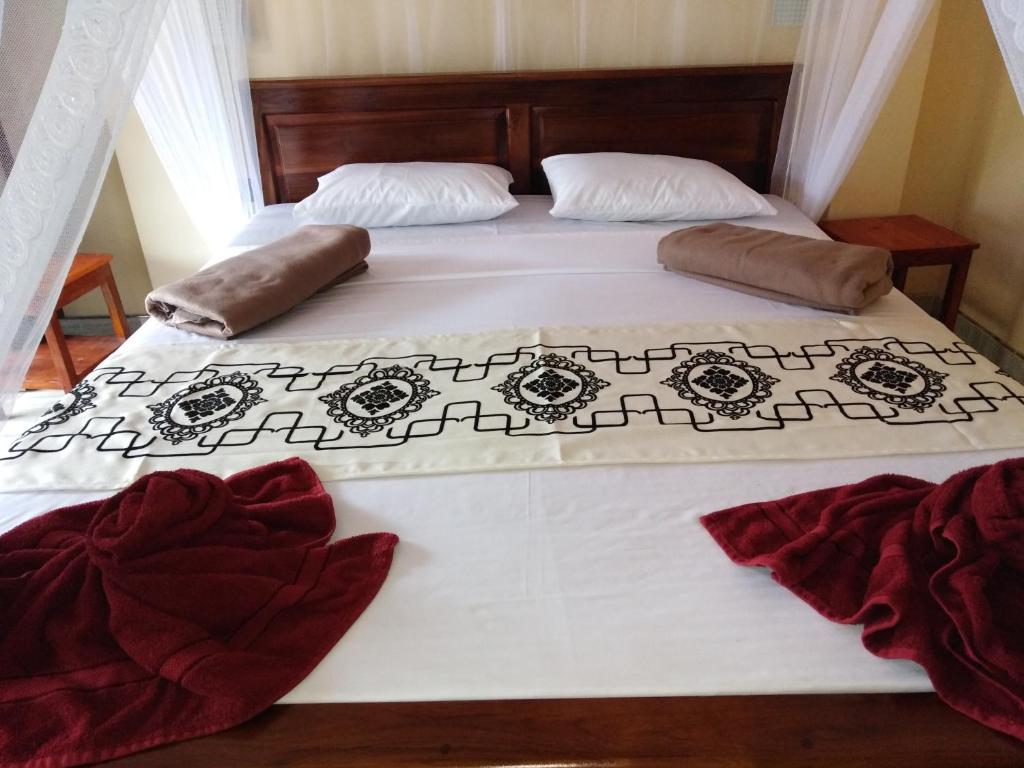 Postel nebo postele na pokoji v ubytování Jade Green Rest Inn