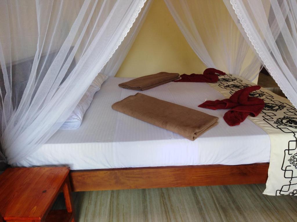 Postel nebo postele na pokoji v ubytování Jade Green Rest Inn
