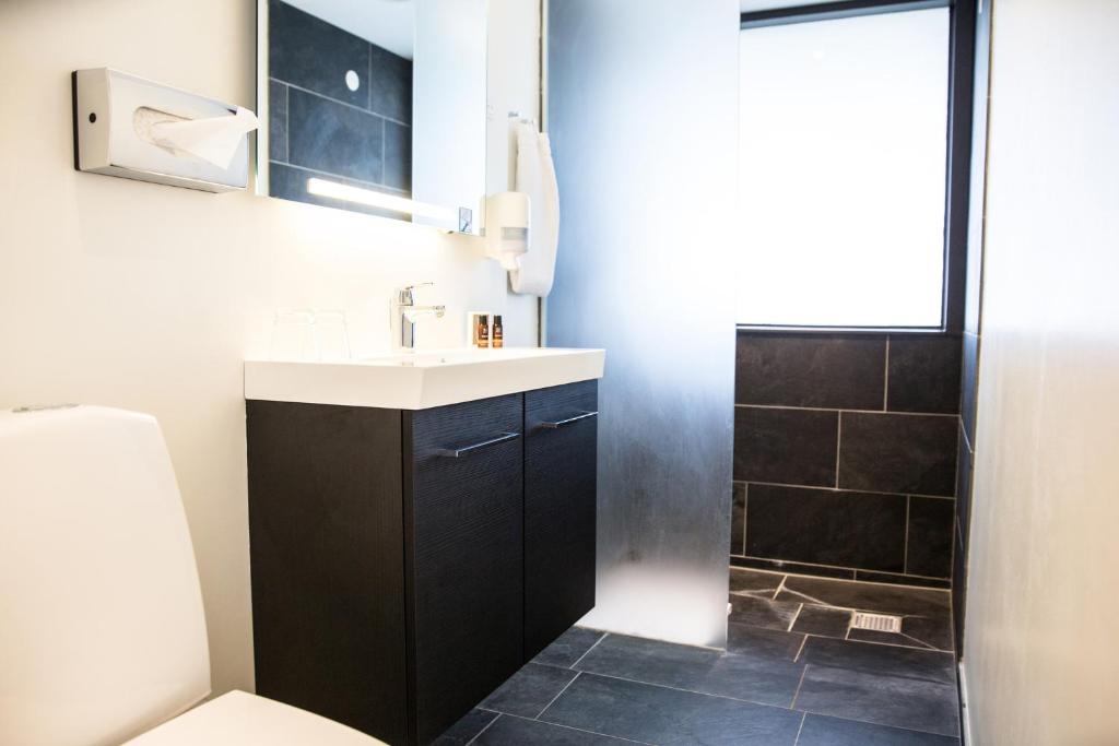 Un baño de Comwell Hvide Hus Aalborg