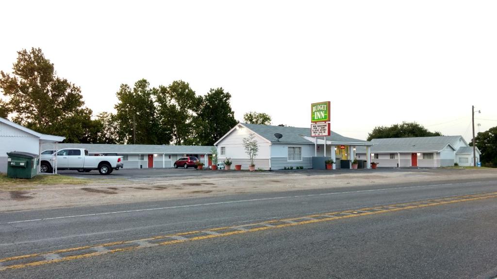 a gas station on the side of a road at Budget Inn Hamilton in Hamilton