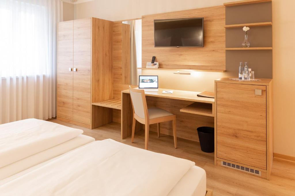 Postel nebo postele na pokoji v ubytování Altstadt-Hotel
