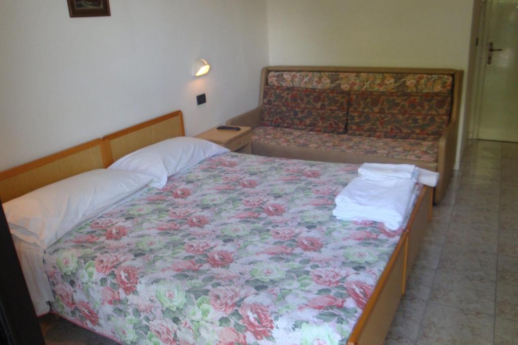 Postel nebo postele na pokoji v ubytování Hotel Vela Azzurra