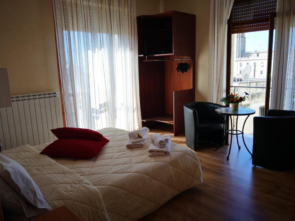 Postel nebo postele na pokoji v ubytování Sant'Oronzo B&B