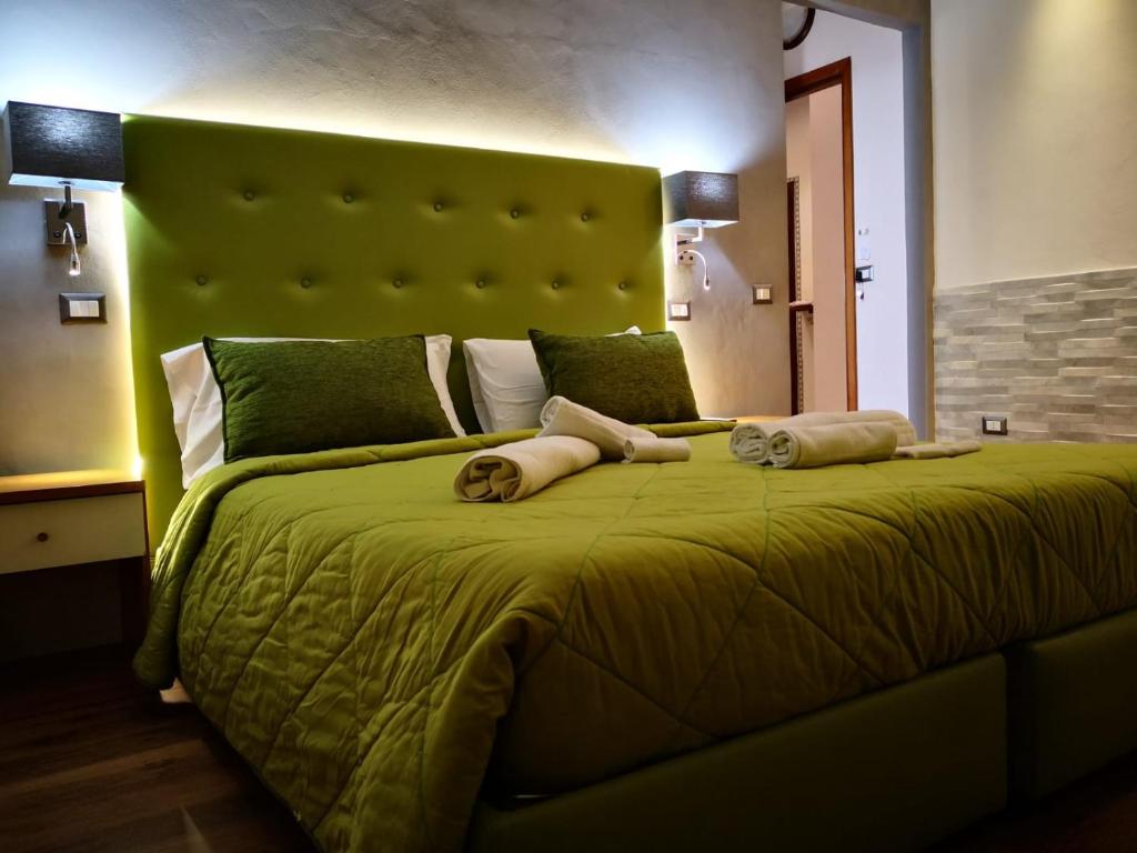 Postel nebo postele na pokoji v ubytování Sant'Oronzo B&B